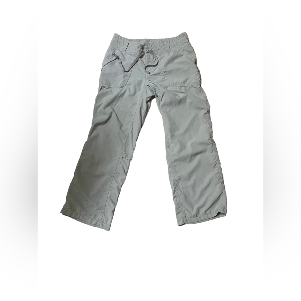 The North Face nylon women’s pants, size 8. Button & drawstring front.